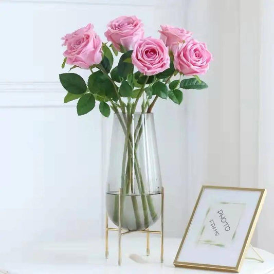 Modern creative dark glass vase with a gold stand 