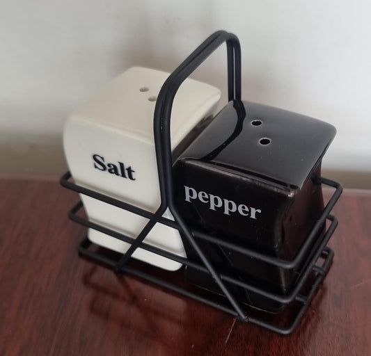 Salt and pepper shaker pot in black metal rack