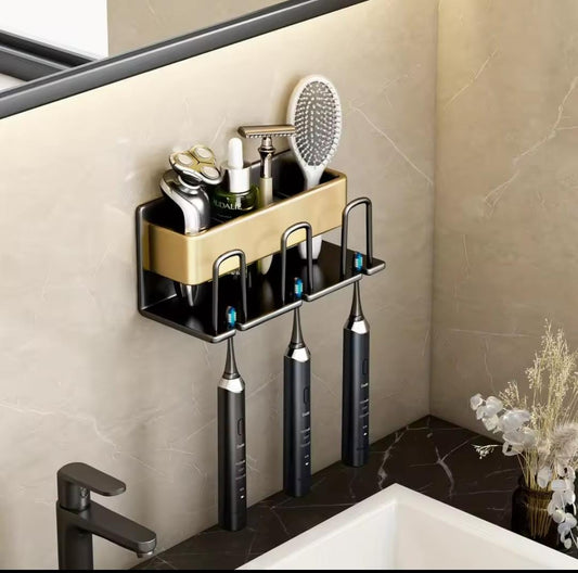 Metallic wall mounted tooth brush/paste holder.