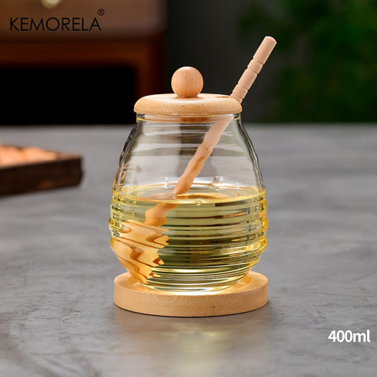 Transparent honey jar with bamboo dipper and lid